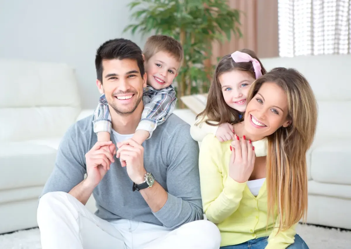 Orthodontics Family Care Prescott AZ Parents and child smiling after orthodontics care in Prescott, AZ