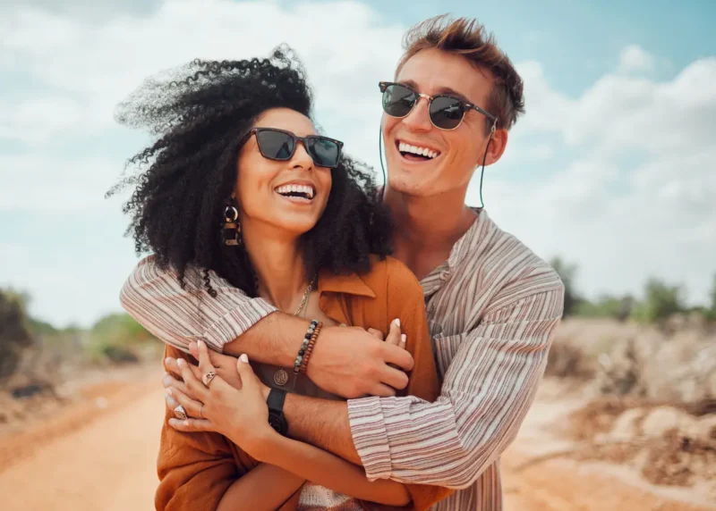 Couple showing confident smiles after orthodontic care in Prescott AZ