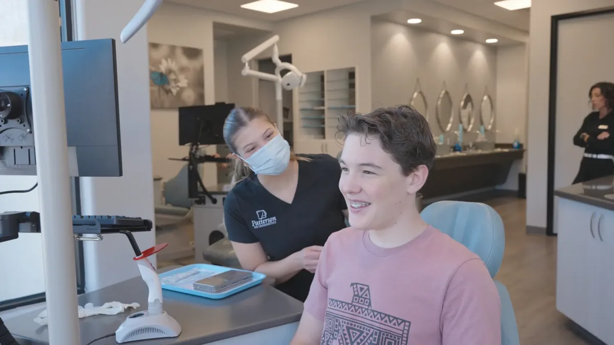Teen patient smiling during orthodontics consultation in Prescott, AZ